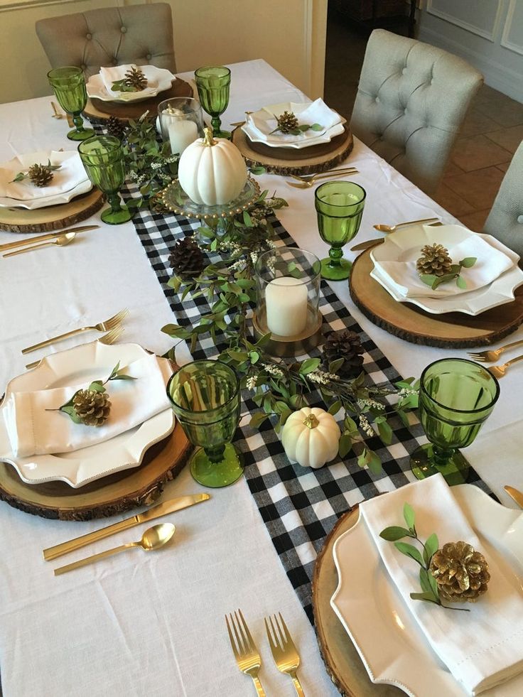 A festive Thanksgiving table adorned with a stylish white and black plaid tablecloth, creating a cozy and elegant ambiance.